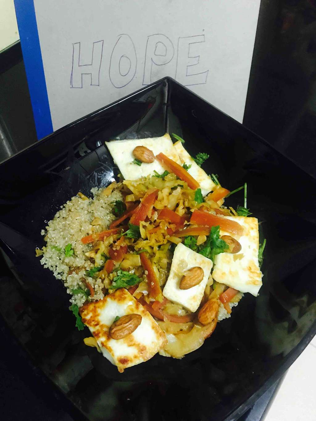 Quinoa bed topped with veggies, paneer n almonds
