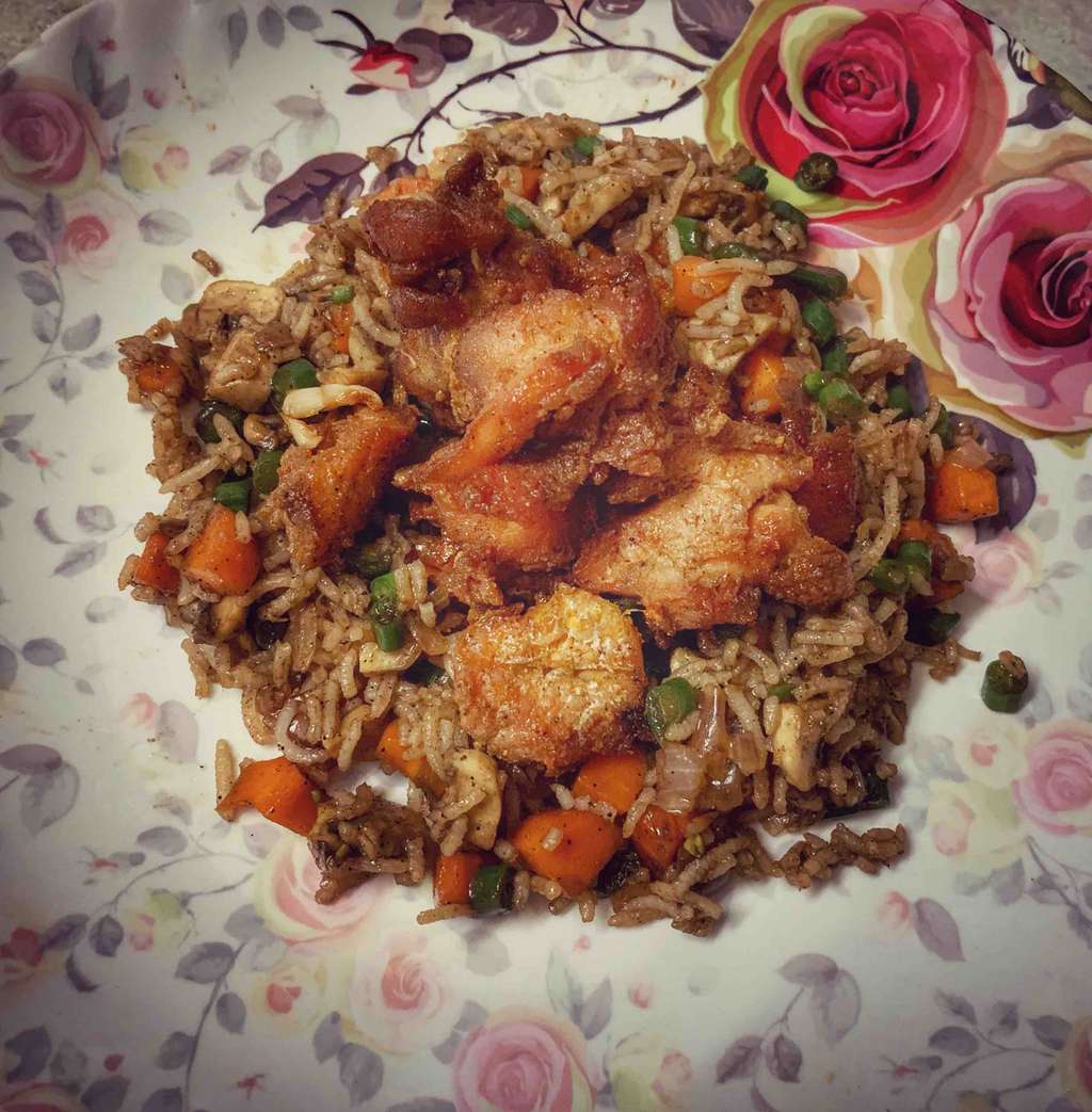 Mushroom fried rice with baked chicken thighs. 