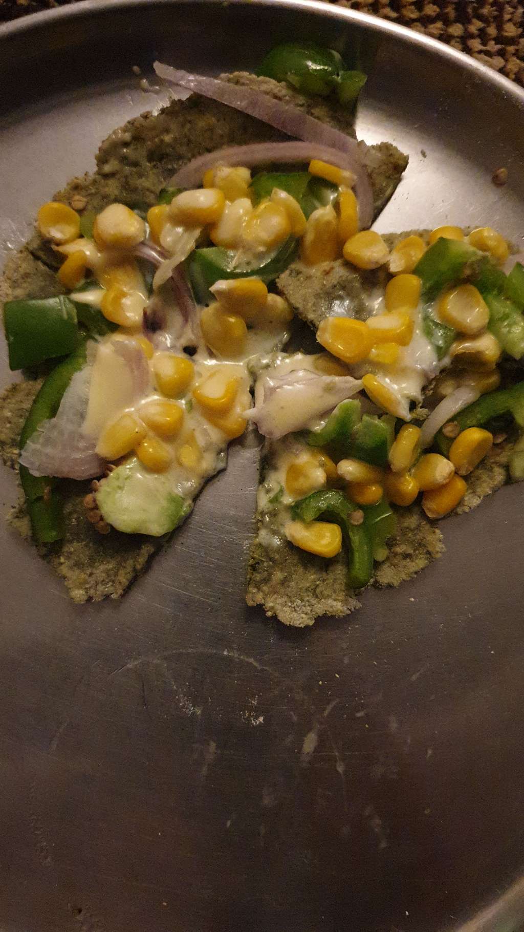 Tawa jowar palak with corn and capsicum pizza 