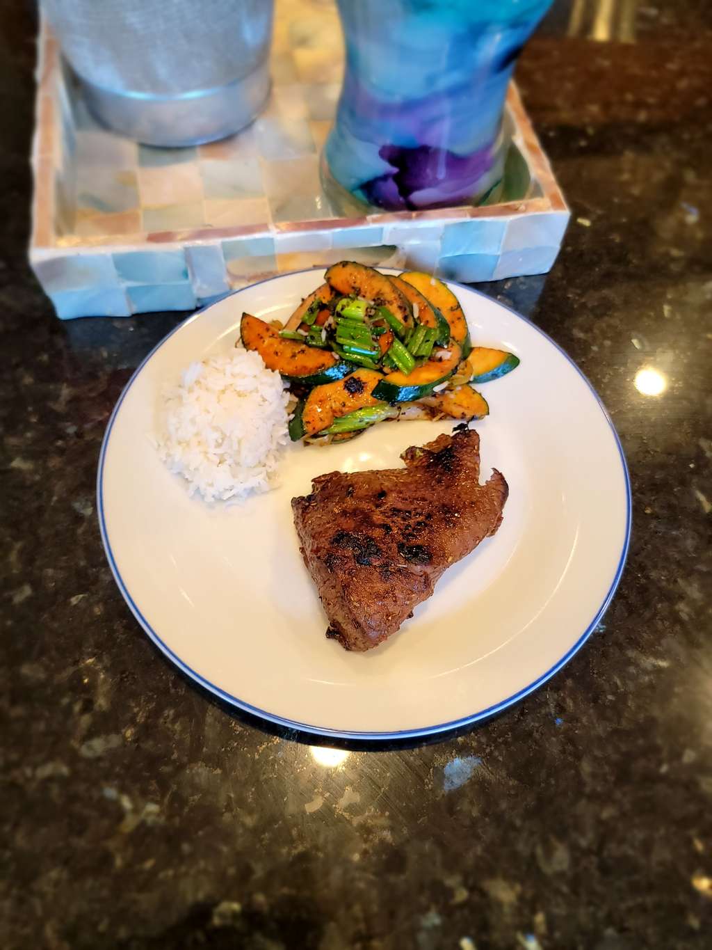 Garlic Butter Grilled steak with jasmine rice and roasted Greens 