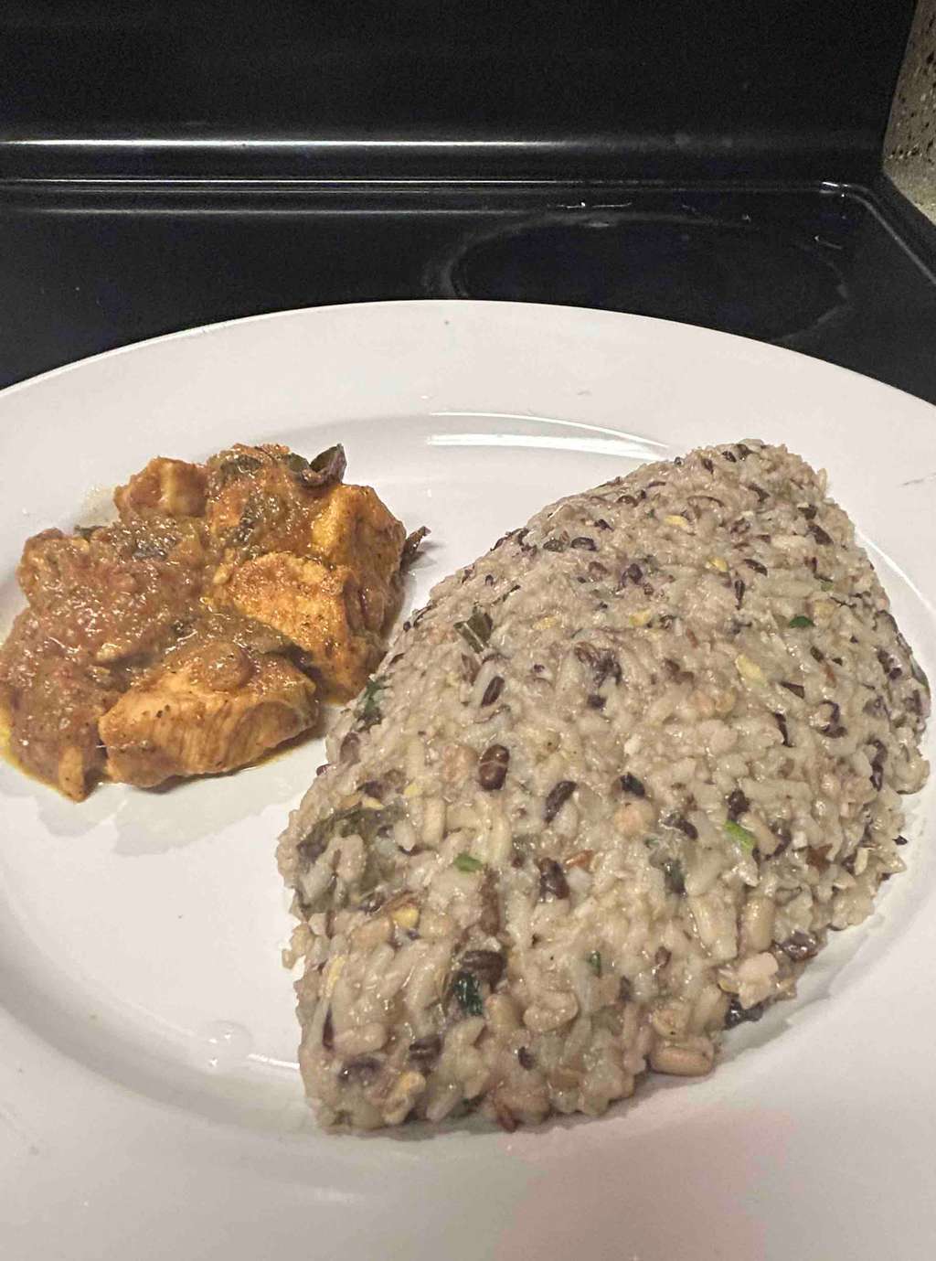 ulluthan soru/ black urad dal rice with chicken tikka curry 