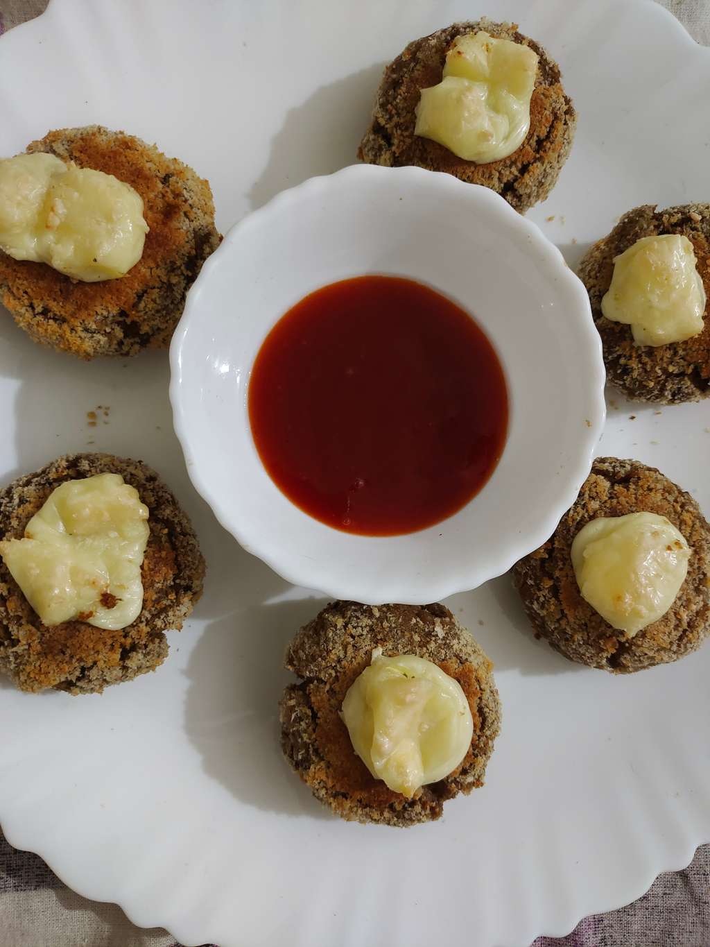 Soya Tikki with melted cheese on top