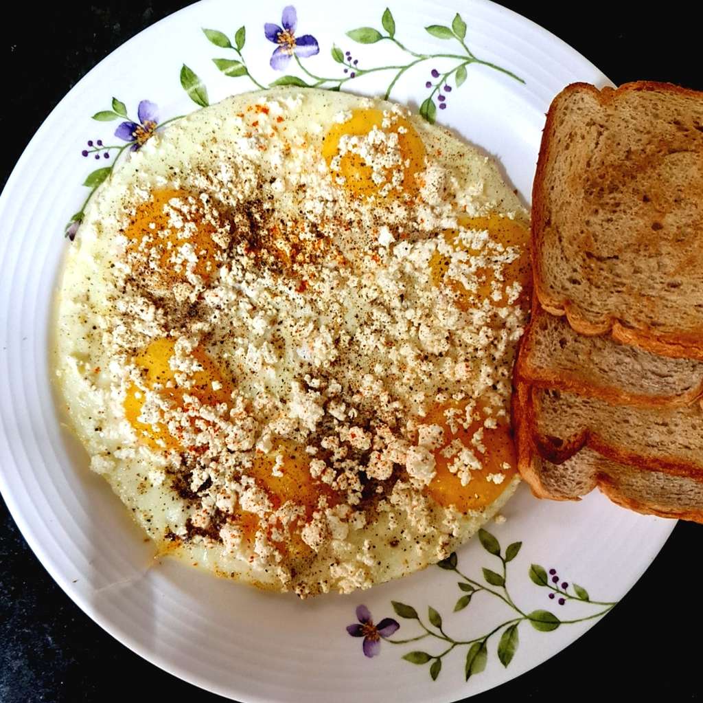Half-fried Egg with Feta Cheese & Bread Slices