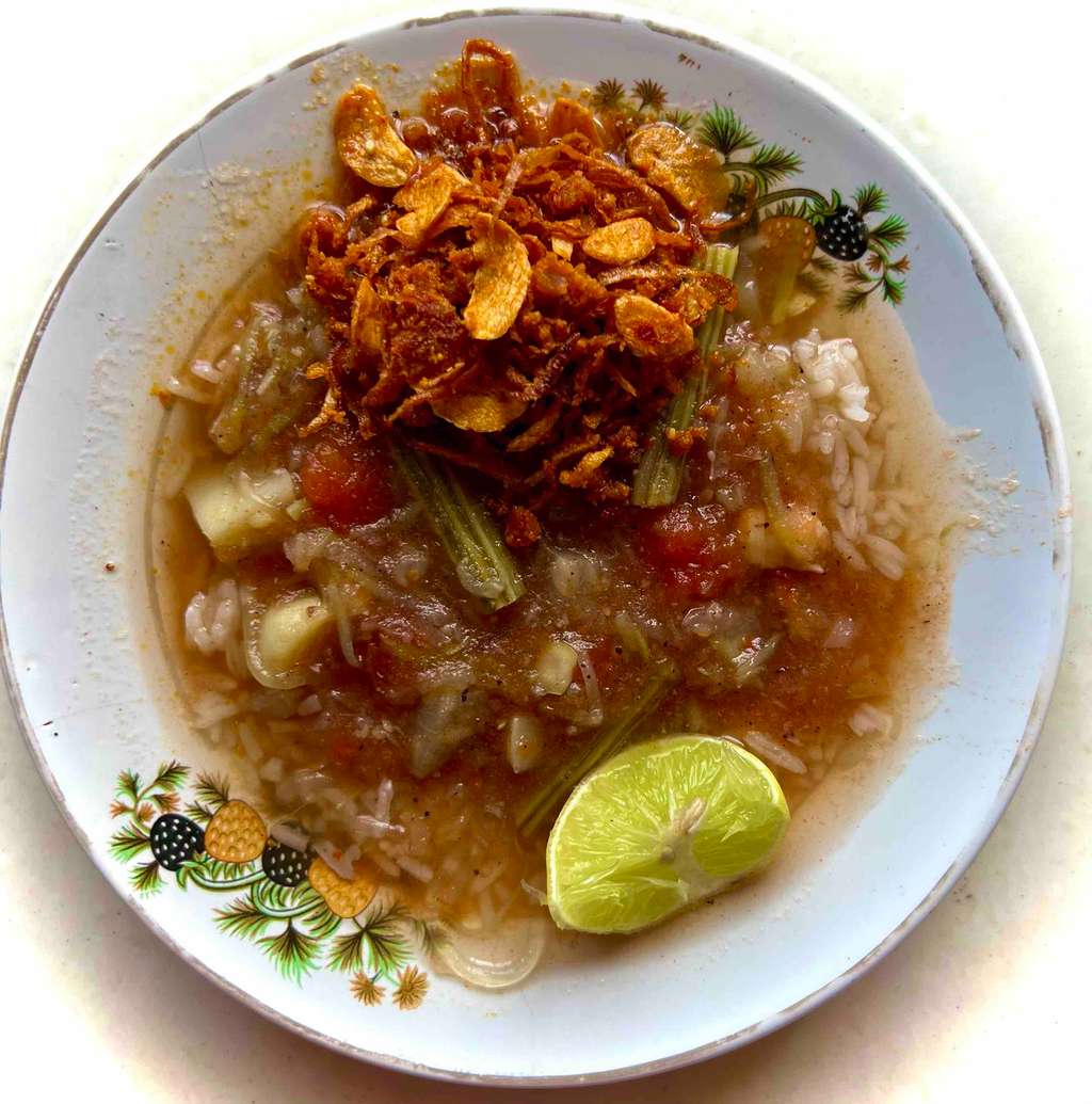 Singaporean veggies noodles soup with roasted shrimp mix