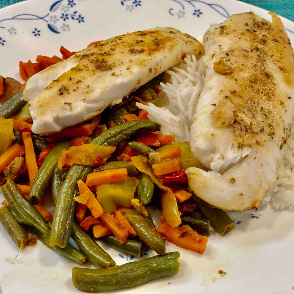 Herb Roasted Tilapia with Grilled veggies over rice.