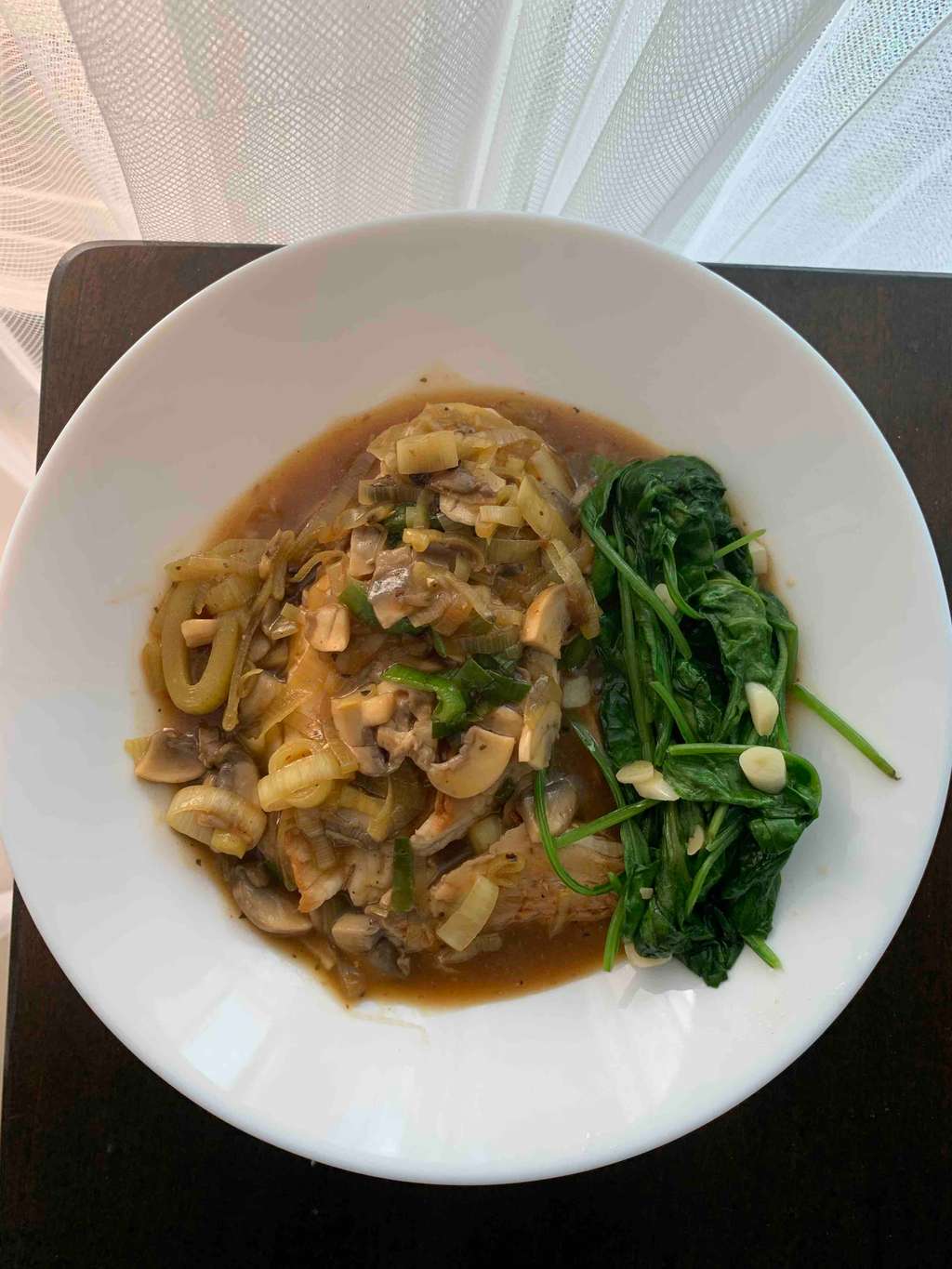 chicken with Leeks and Mushrooms Sauce with sautéed spinach on the side