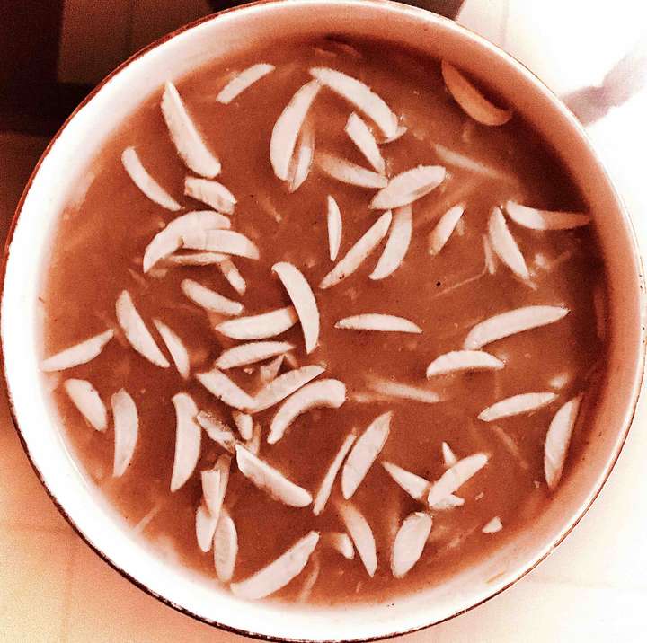 Raw mango- coconut rich wheatish soup