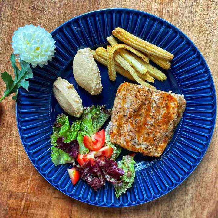 Extra Hot Dalle Grilled Basa with hummus and salad