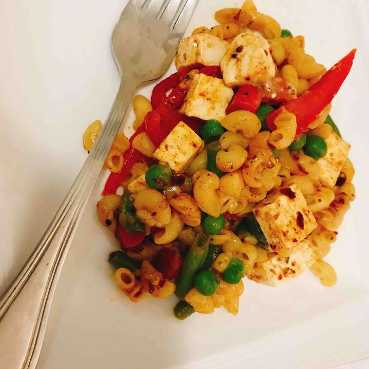 Stir fried cheesy veggie paneer pasta 