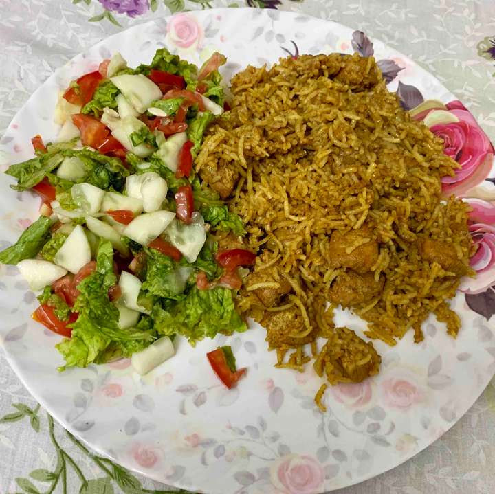 Chicken Sokha rice with salad.