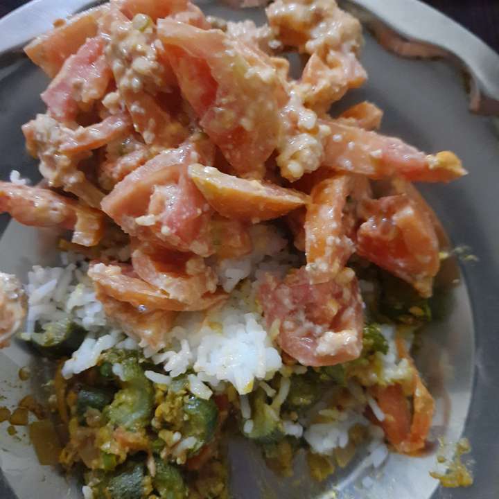 rice with tomato sald and sabji
